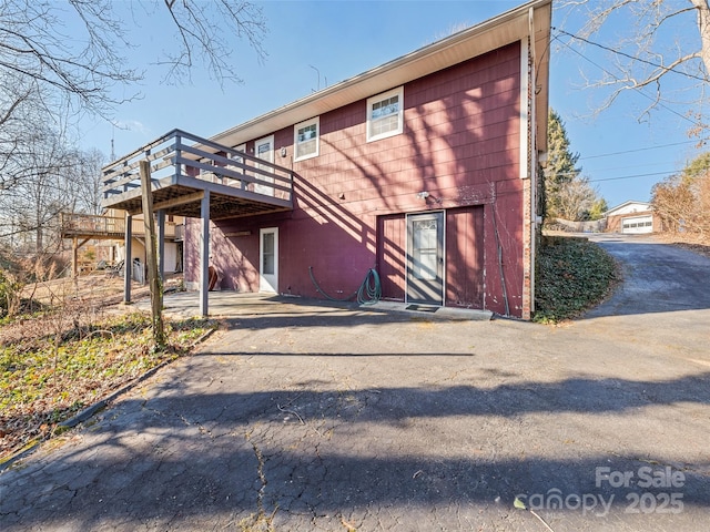 rear view of property with a deck