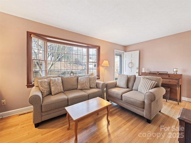 living room featuring light wood-type flooring