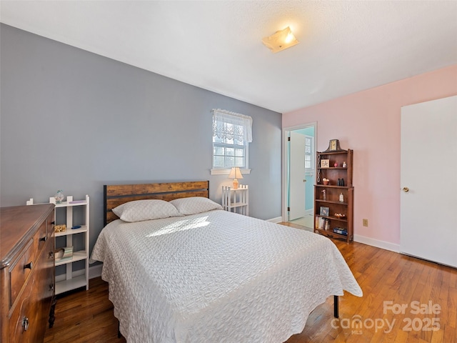 bedroom featuring hardwood / wood-style flooring