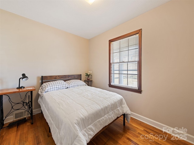 bedroom featuring wood-type flooring