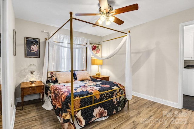 bedroom featuring hardwood / wood-style floors and ceiling fan