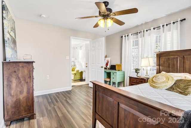 bedroom featuring ceiling fan and dark hardwood / wood-style flooring