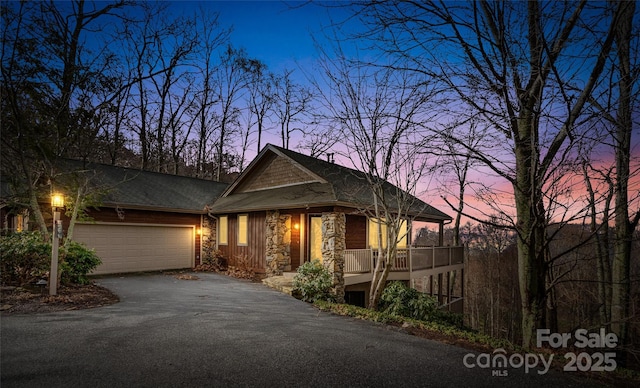 view of front of property with a garage and covered porch