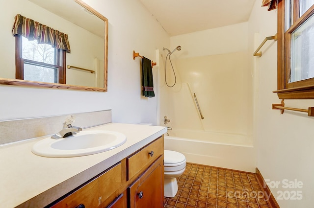 full bathroom with vanity, bathtub / shower combination, and toilet