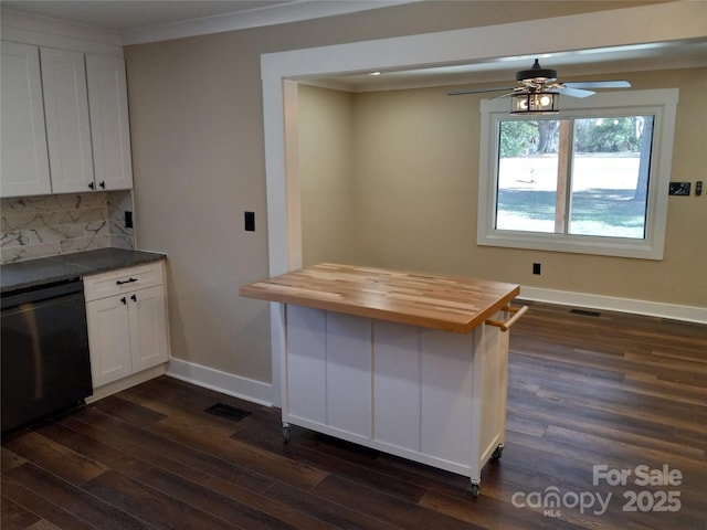 kitchen featuring dark wood-type flooring, butcher block counters, white cabinetry, tasteful backsplash, and dishwasher