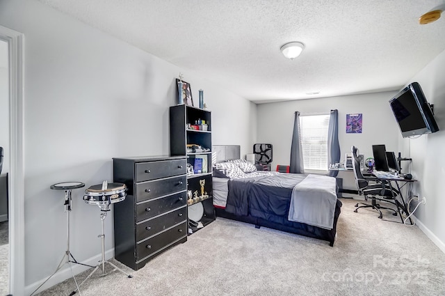 bedroom with carpet flooring and a textured ceiling