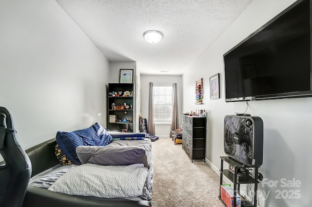 carpeted bedroom featuring a textured ceiling