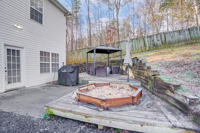 wooden terrace with a gazebo and grilling area