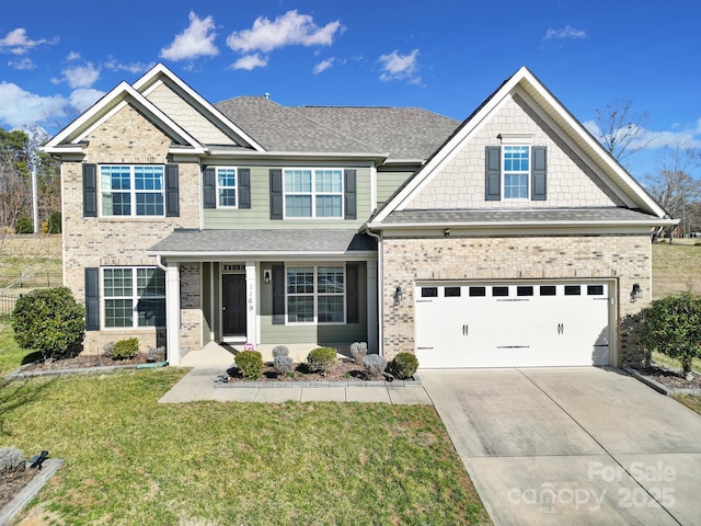 craftsman-style house featuring a garage and a front lawn