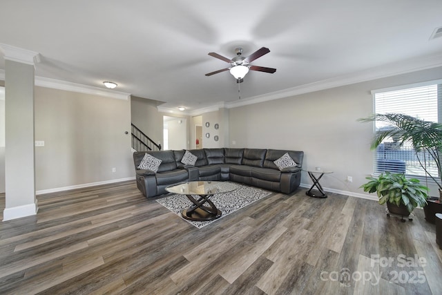 living room with dark hardwood / wood-style flooring and ornamental molding