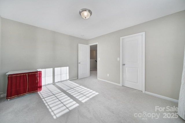 unfurnished bedroom featuring light colored carpet