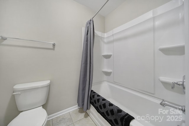 bathroom featuring shower / tub combo, toilet, and tile patterned floors