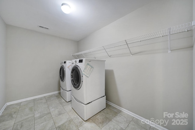 laundry area featuring separate washer and dryer