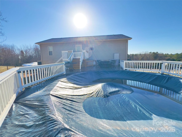 view of pool with a wooden deck