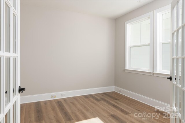 4243 Candlewood Dr Unit 9, Sherrills Ford, NC 28673 - unfurnished room with baseboards, french doors, and wood finished floors