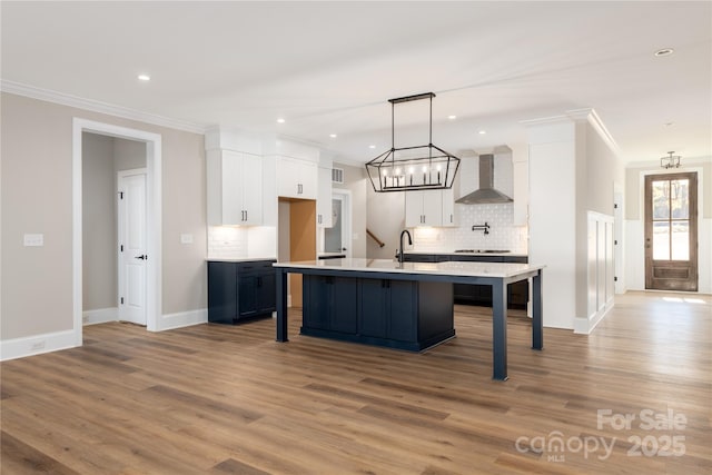 4243 Candlewood Dr Unit 9, Sherrills Ford, NC 28673 - kitchen featuring light countertops, wall chimney range hood, decorative backsplash, crown molding, and a breakfast bar