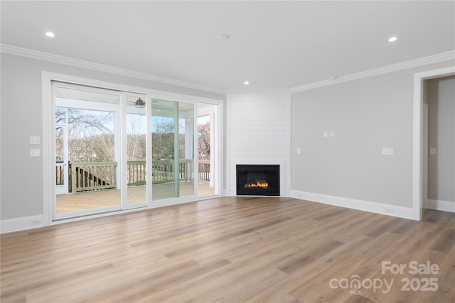 4243 Candlewood Dr Unit 9, Sherrills Ford, NC 28673 - unfurnished living room featuring baseboards, light wood-type flooring, crown molding, and a large fireplace