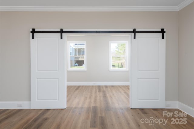4243 Candlewood Dr Unit 9, Sherrills Ford, NC 28673 - unfurnished room with a barn door, crown molding, and wood finished floors
