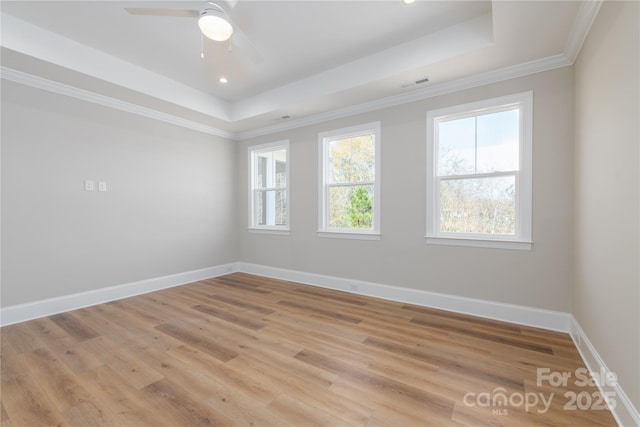 4243 Candlewood Dr Unit 9, Sherrills Ford, NC 28673 - unfurnished room with a raised ceiling, visible vents, crown molding, baseboards, and light wood-style flooring