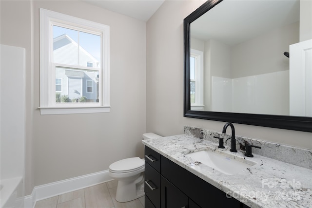 4243 Candlewood Dr Unit 9, Sherrills Ford, NC 28673 - bathroom with baseboards, toilet, vanity, and plenty of natural light