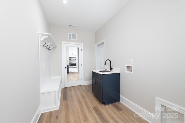 4243 Candlewood Dr Unit 9, Sherrills Ford, NC 28673 - mudroom with baseboards, light wood-style flooring, visible vents, and a sink