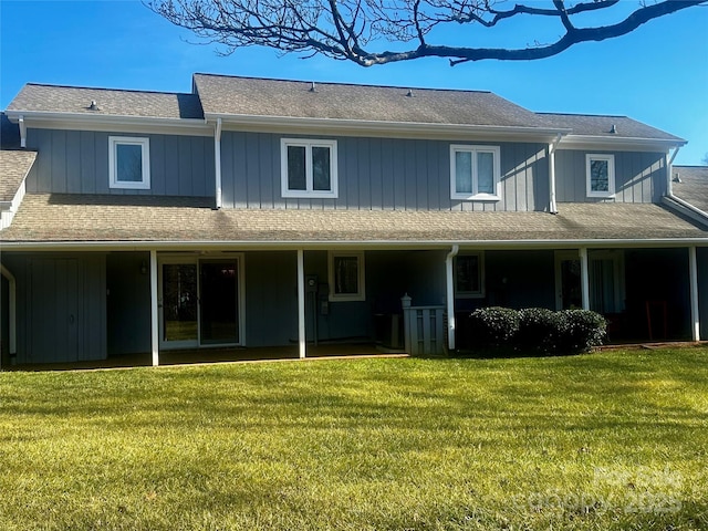 rear view of house with a yard