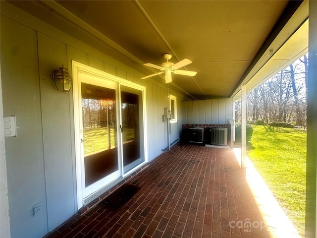 view of patio / terrace featuring cooling unit and ceiling fan