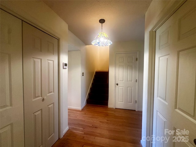 corridor with light hardwood / wood-style floors