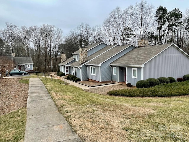 view of side of home featuring a yard