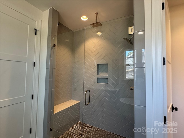 bathroom featuring recessed lighting and a stall shower