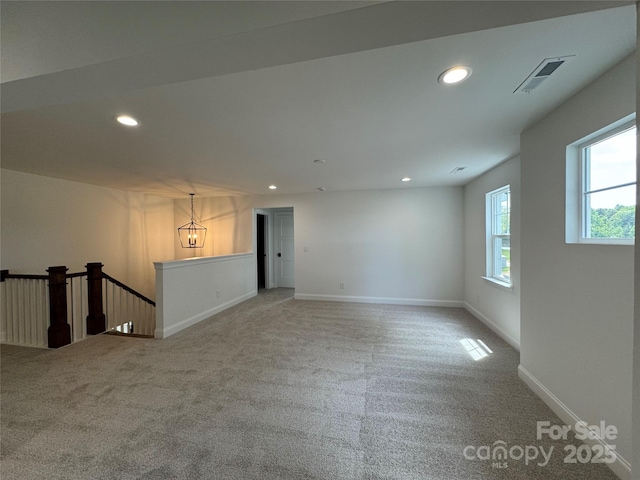interior space featuring recessed lighting, visible vents, carpet flooring, and baseboards