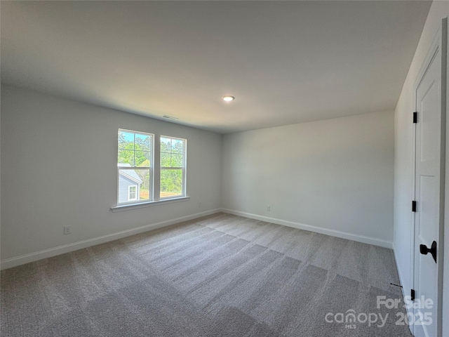 unfurnished room featuring visible vents, light carpet, baseboards, and recessed lighting