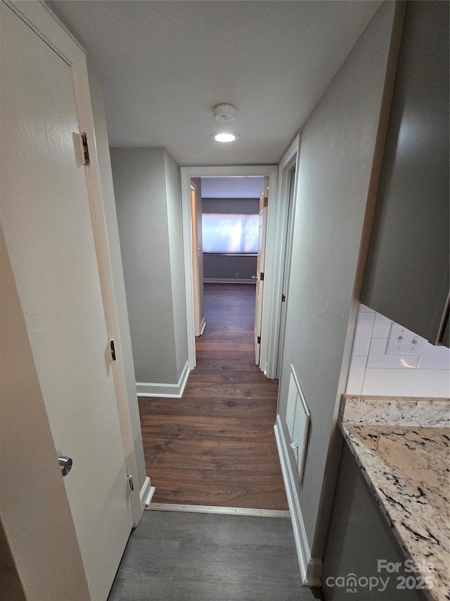 hallway featuring dark hardwood / wood-style floors