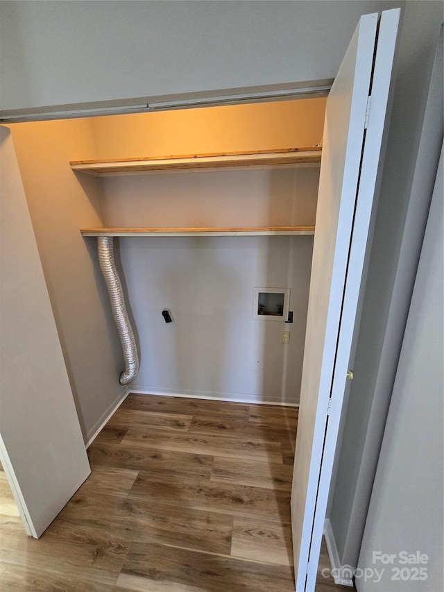 laundry area featuring hookup for a washing machine and hardwood / wood-style floors