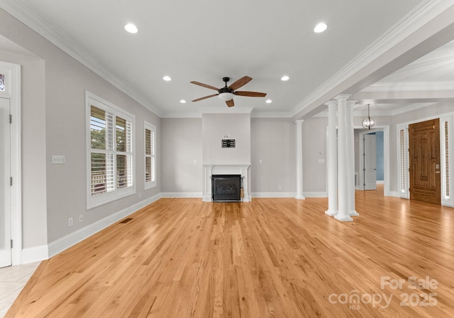 unfurnished living room featuring ornamental molding, decorative columns, light hardwood / wood-style floors, and ceiling fan