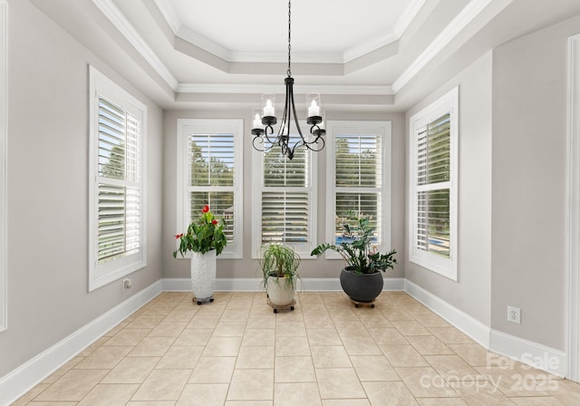 living area featuring an inviting chandelier, ornamental molding, a raised ceiling, and light tile patterned floors