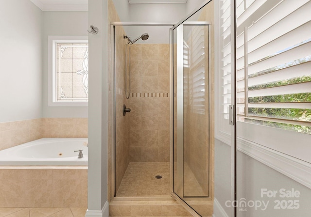 bathroom featuring tile patterned floors, plenty of natural light, plus walk in shower, and ornamental molding