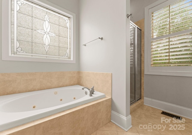 bathroom featuring tile patterned flooring and shower with separate bathtub