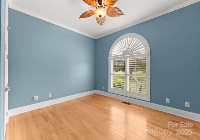 unfurnished room featuring crown molding, light wood-type flooring, and ceiling fan