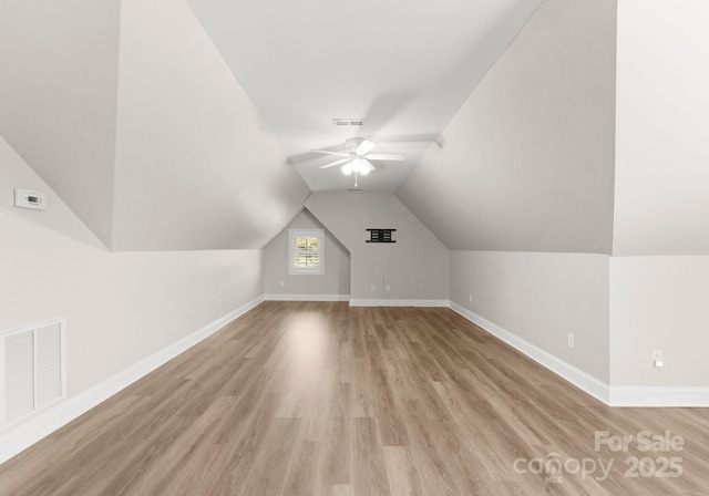 bonus room with ceiling fan, lofted ceiling, and light hardwood / wood-style flooring