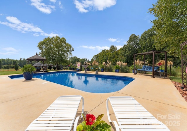 view of swimming pool with a gazebo, a pergola, and a patio area