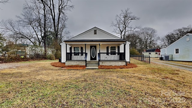 bungalow-style house with a porch and a front yard