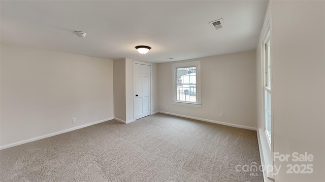 unfurnished room featuring carpet floors