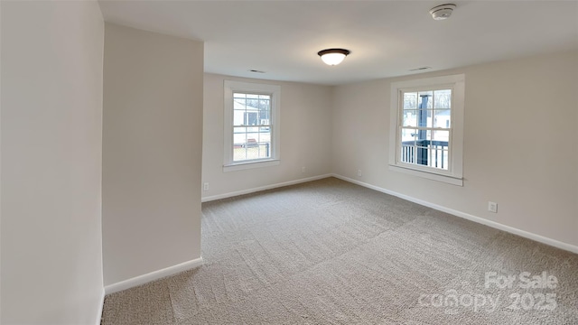 spare room featuring carpet flooring