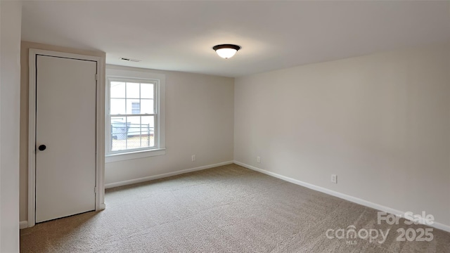 unfurnished room with carpet flooring