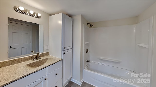 bathroom featuring vanity and bathtub / shower combination