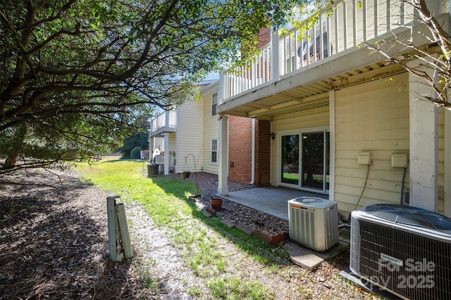 view of property exterior featuring cooling unit and a patio area