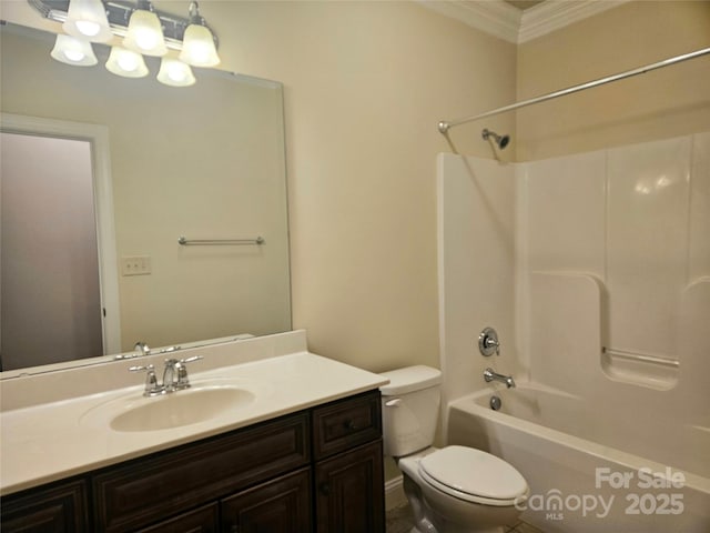 full bathroom featuring crown molding, vanity, washtub / shower combination, and toilet