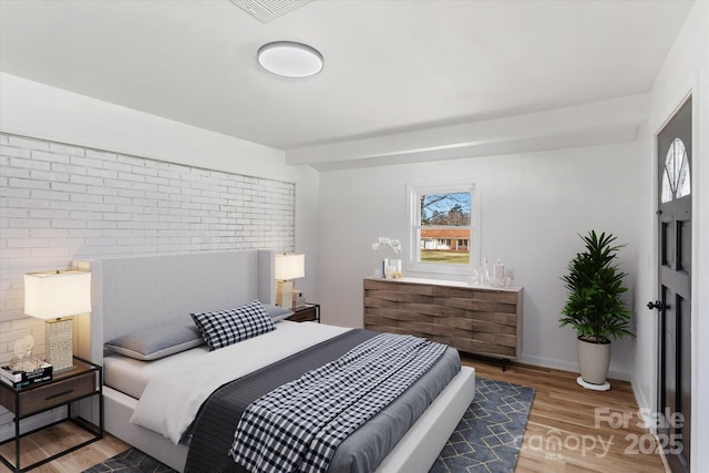 bedroom featuring hardwood / wood-style floors