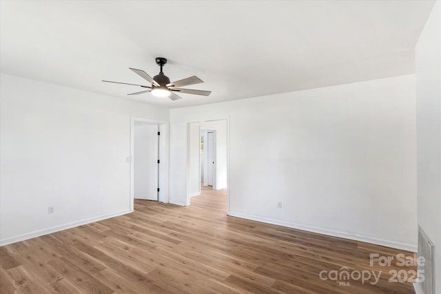 unfurnished room featuring ceiling fan and light hardwood / wood-style flooring